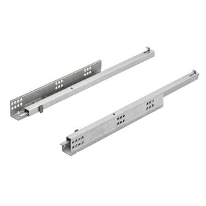 Mecanismo de guía oculta UFA con extracción total y sistema de apertura push para cajones sin tiradores.