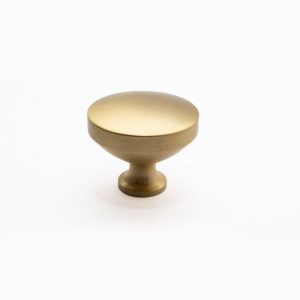 Tirador de mueble circular en acabado bronce satinado modelo Misiones, diseño tipo lenteja.